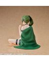 Vue arrière de la figurine Übel Roomwear montrant sa coiffure et sa couverture verte.